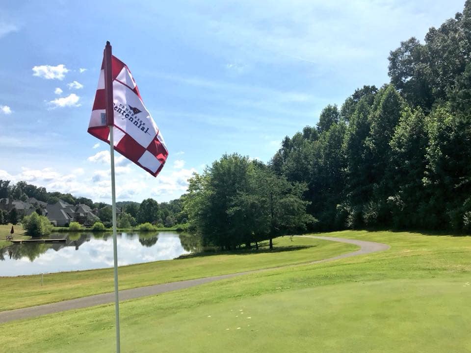 Checkered red flag on golf course